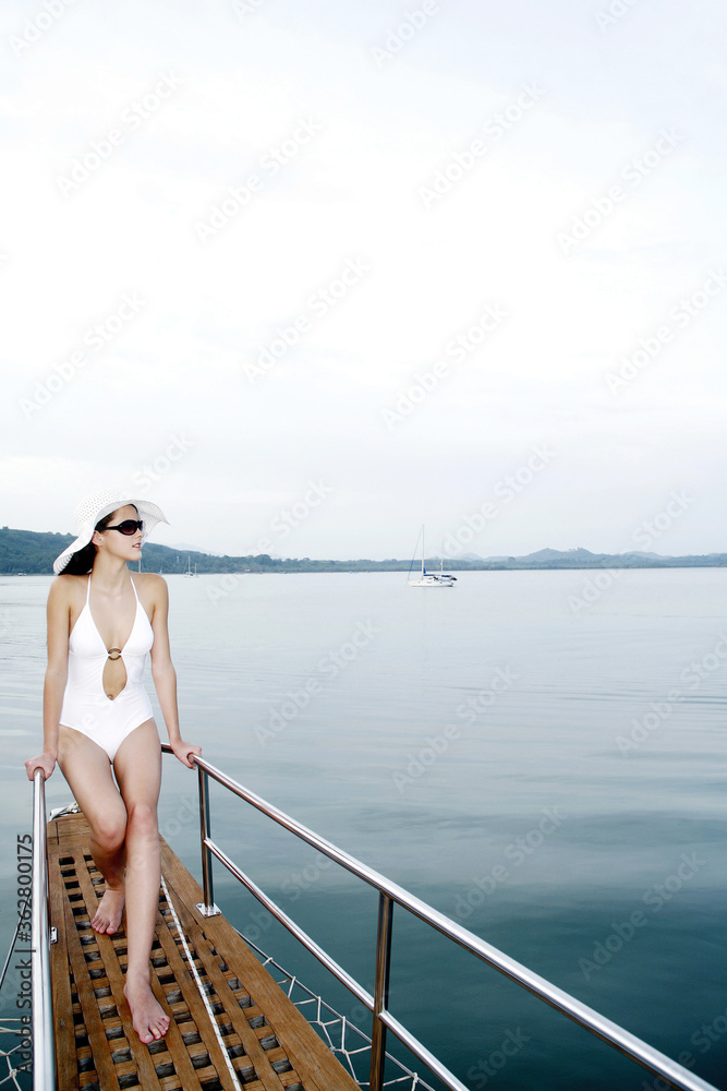 Woman enjoying sea view from the rear of a boat