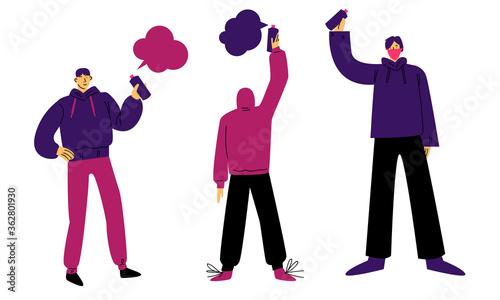 Young boys artists in hoodies drawing graffiti art on walls with spray color
