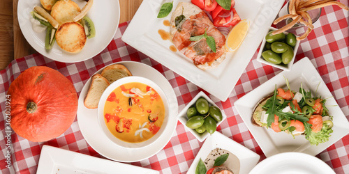 Traditional Italian cuisine, Italian concept. Sea food soup, grilled meat, traditional bruschetta.