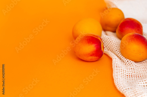 orange apricots on a orange background close-up