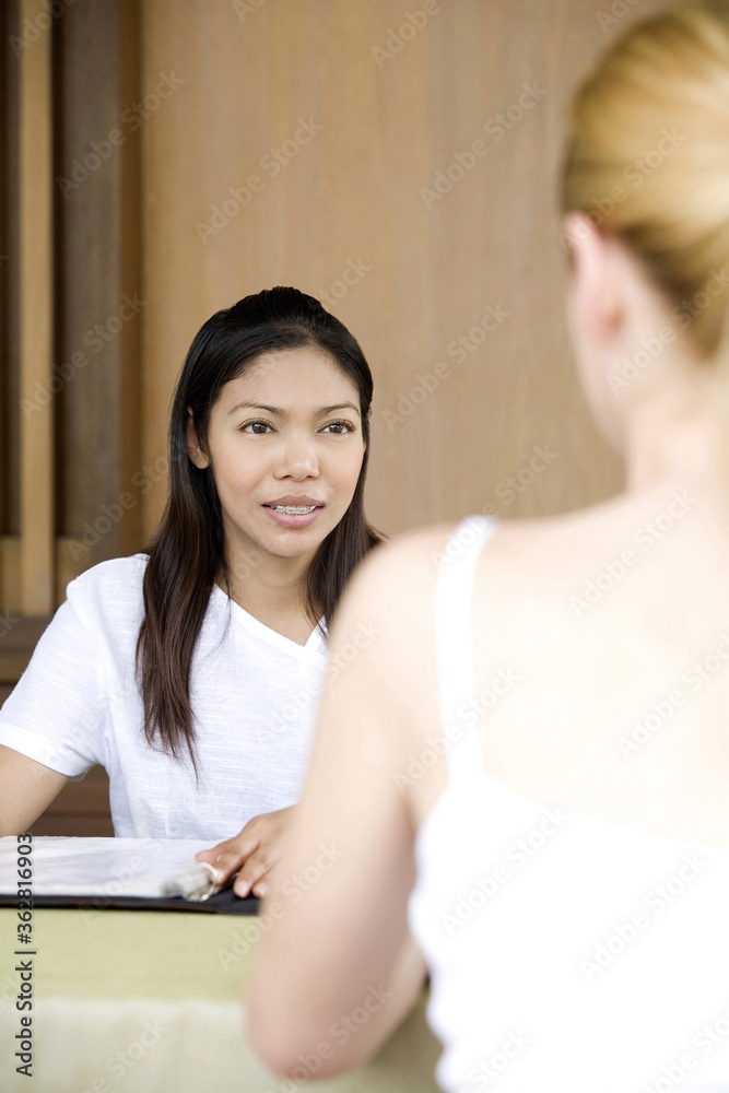 Women at the spa reception counter Women at the spa reception counter