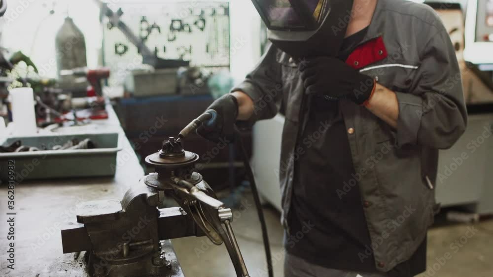 Auto mechanic repairing a car in a workshop.car repair concept Auto mechanic repairing a car in a workshop.car repair concept