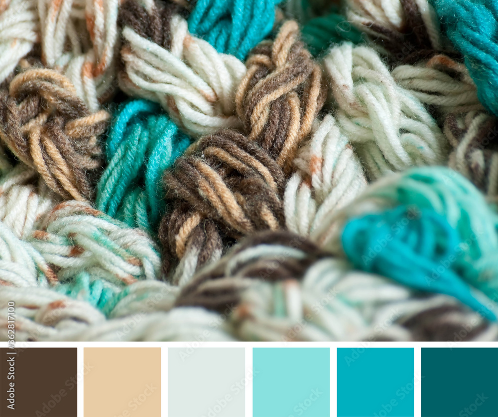 Close up colorful yarn texture background, beige, brown and blue strains.  Shallow depth of focus. Color palette swatches, combination of colors,  inspired by winter. Stock Photo