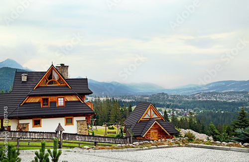 Guest house in the traditional mountain style and mountain landscape. Not far from Zakopane. Tatra mountains. Poland.