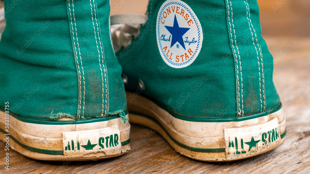 London, England - May 17, 2014: Pair of Converse Baseball Boots in worn  condition, Converse is an American shoe company founded in 1908 Stock Photo  | Adobe Stock