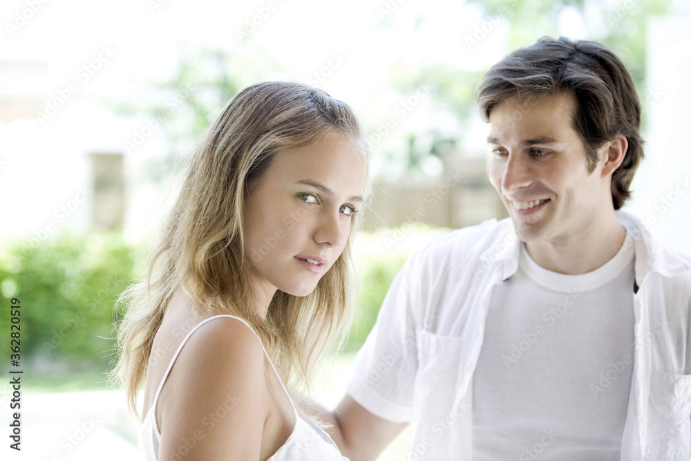 Man looking at woman, woman looking at camera Man looking at woman, woman looking at camera
