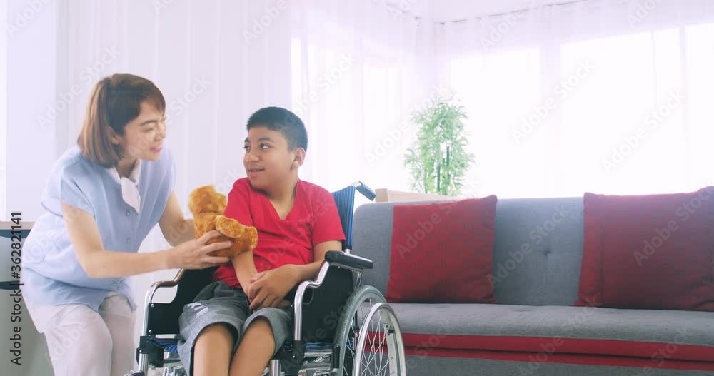Happy family with mother and disabled son spending time together at home. Happy family with mother and disabled son spending time together at home.