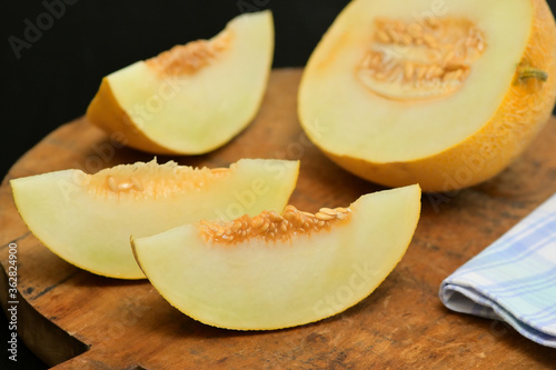 Yellow Melon with slices on a table