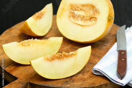 Yellow Melon with slices on a table