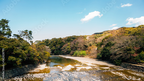 Isuzu River and mountain at spring in Ise, Mie, Japan photo