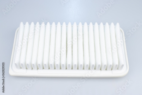 car air filter on a white background.