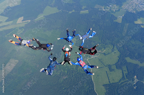 Skydiving. Formations. A group of skydivers is in the sky.