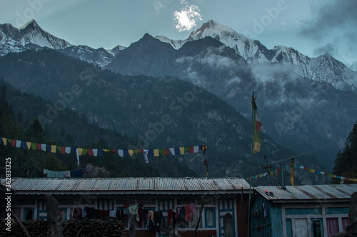 Buddhist prayer flags by the nepalese mountains, Annapurna circuit, Nepal photo