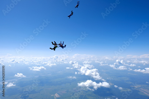 Skydiving. Formations. A group of skydivers is in the sky.