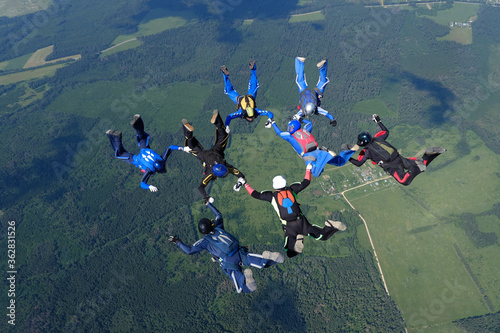 Skydiving. Formations. A group of skydivers is in the sky.