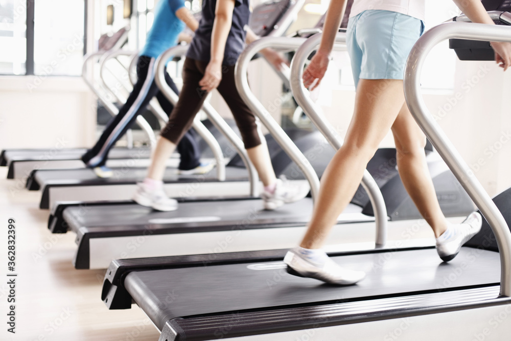 Obraz premium Women running on treadmills