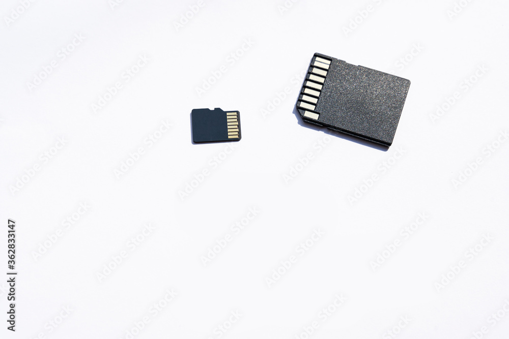 black memory cards on the white background, selective focus black memory cards on the white background, selective focus