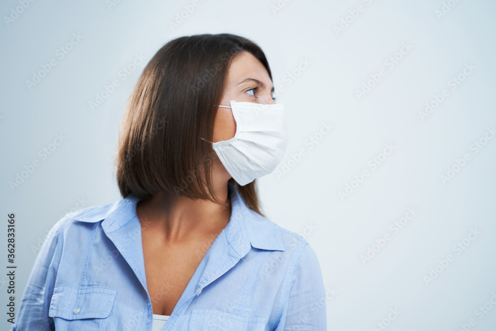 Attractive woman wearing protective mask isolated over white background Attractive woman wearing protective mask isolated over white background