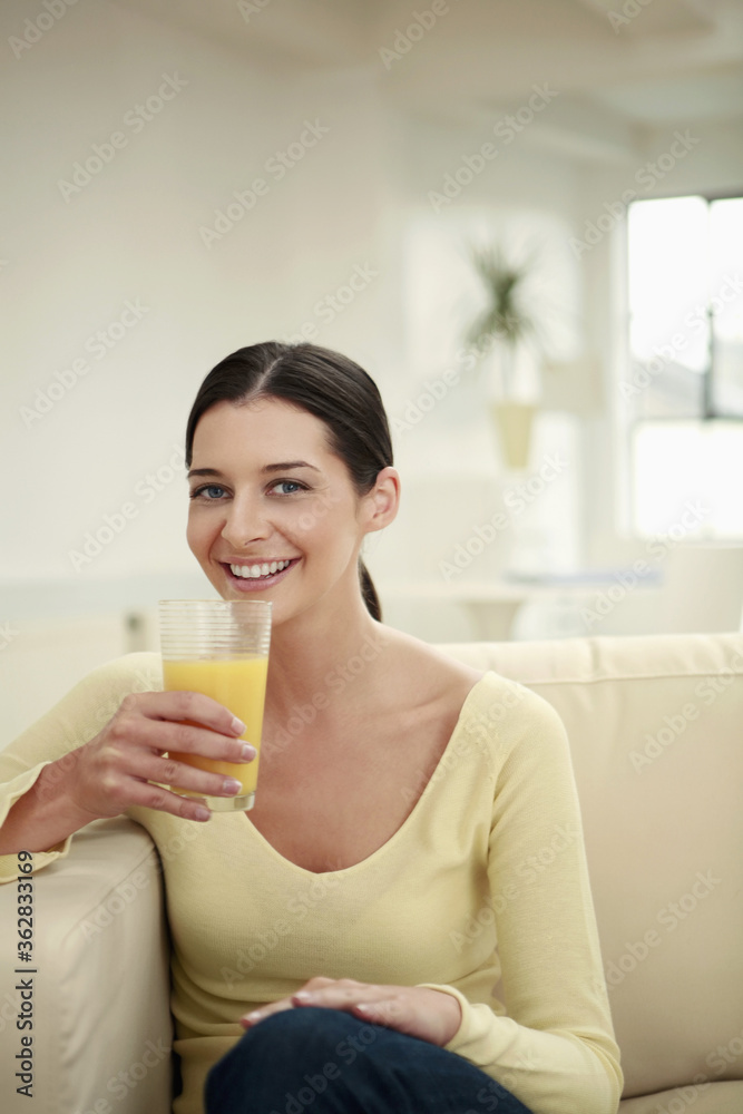 Woman with a glass of fresh orange juice Woman with a glass of fresh orange juice