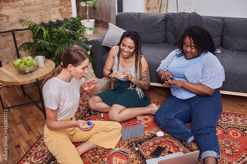 Excited women having beauty time at home