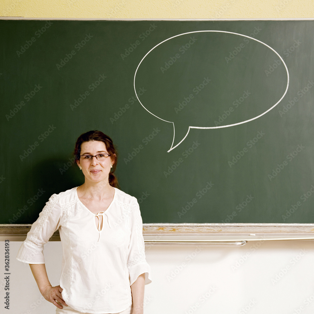 Woman with a speech bubble on the blackboard