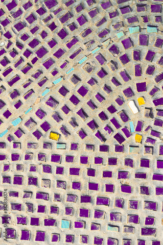 Detail of beautiful purple ceramic mosaic in the adorned building. Ancient mosaic as decorative background, vertical image photo