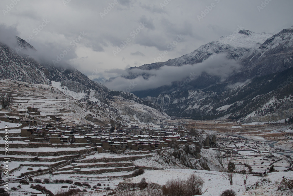 Ledar mountain village in snow by Marshyangdi river, Annapurna circuit, Nepal