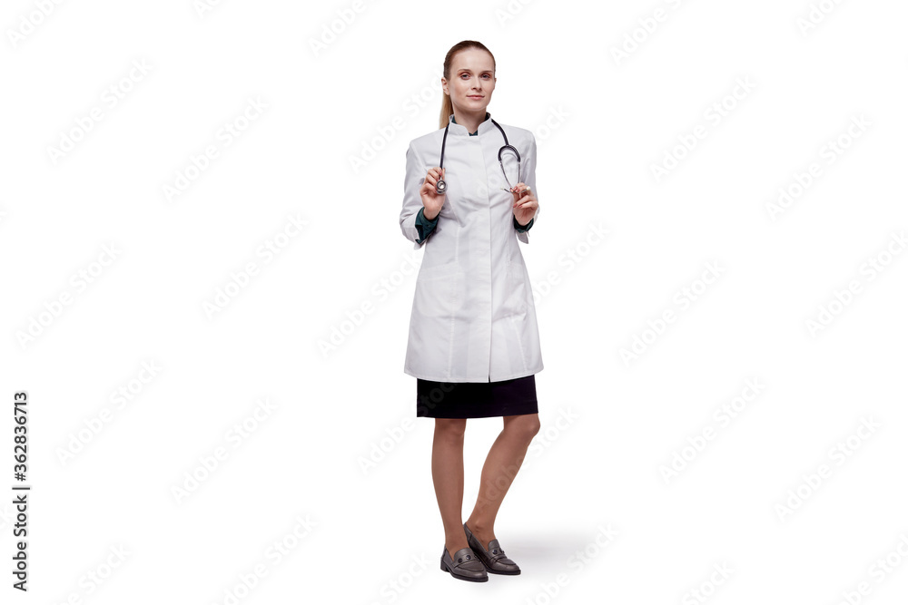 Young woman doctor looking at the camera. On the neck is a phonendoscope. Young woman doctor looking at the camera. On the neck is a phonendoscope.