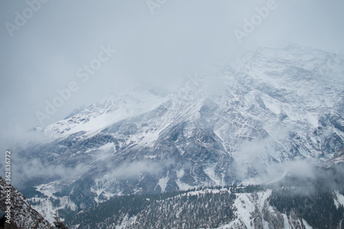 Snowy himalayan mountains by Ledar village, Annapurna circuit, Nepal photo