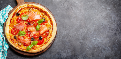 Tasty homemade seafood pizza with salmon