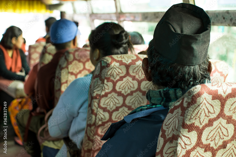 Nepalese people in traditional clothing commuting on a local bus to Ngadi, Annapurna circuit, Nepal