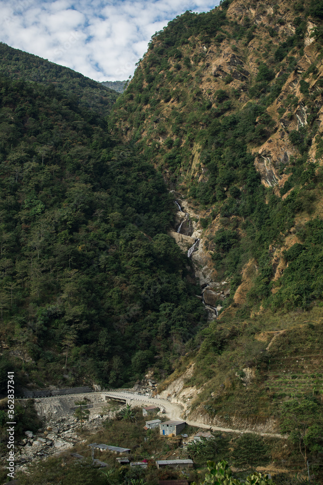 High waterfall flowing in the nepalese mountains, Annapurna circuit, Nepal
