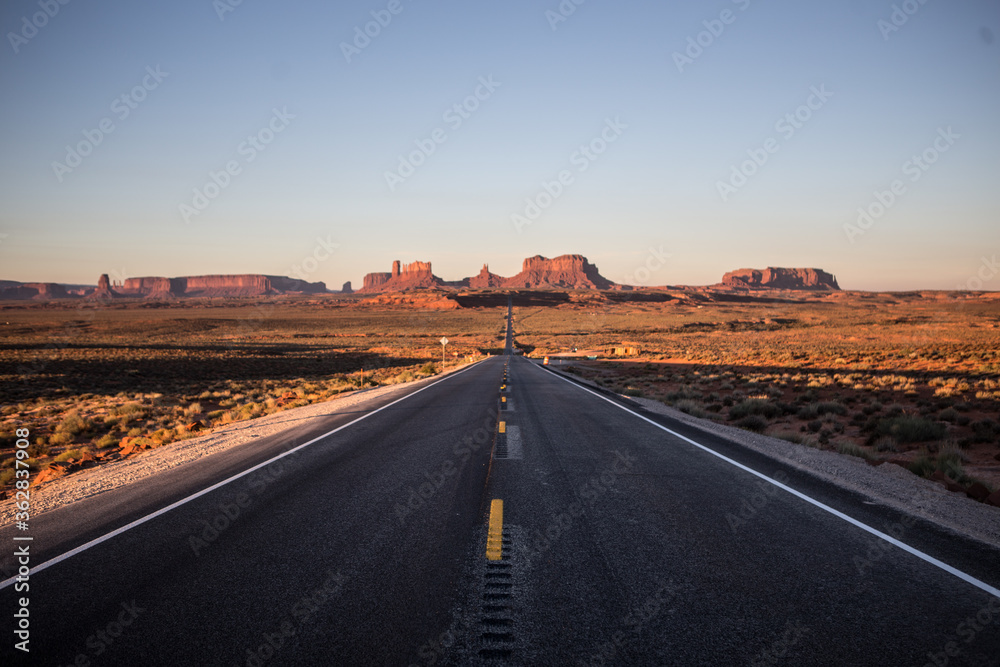 Road shot of Monument Valley at sunrise, in Utah.