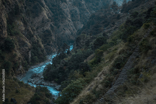 Beautiful Marshyangdi river flowing through a canyon valley underneath rock stairs, Annapurna circuit, Nepal