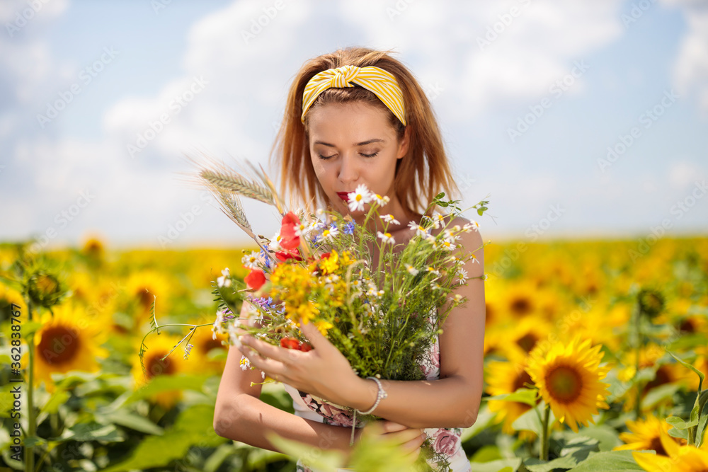 Pretty young woman on a sunflowers field Pretty young woman on a sunflowers field