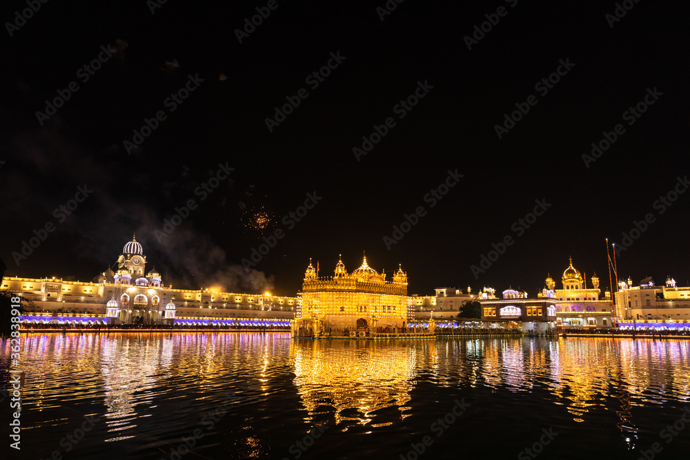 Golden Temple Amritsar lit by Diya and fire crackers Guru Purab festival and Diwali 