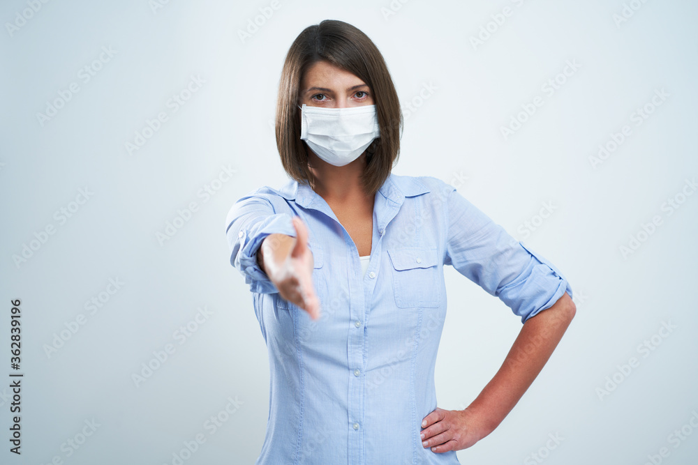 Attractive woman wearing protective mask isolated over white background Attractive woman wearing protective mask isolated over white background