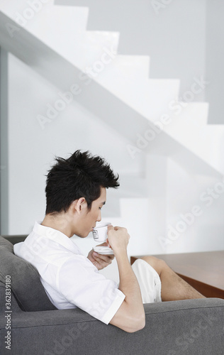 Man enjoying a cup of coffee at home