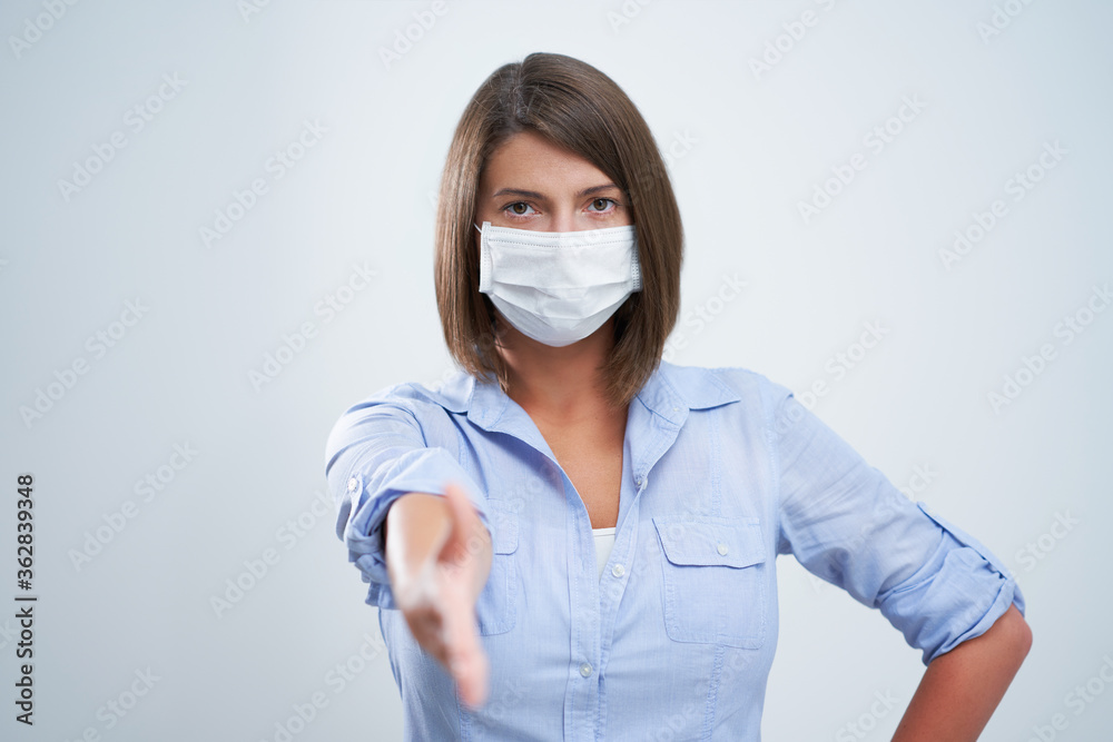 Attractive woman wearing protective mask isolated over white background Attractive woman wearing protective mask isolated over white background