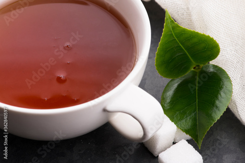 cup of tea with fresh leaves