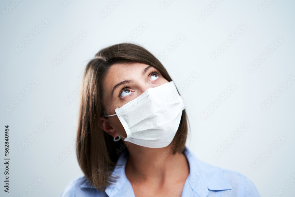 Attractive woman wearing protective mask isolated over white background Attractive woman wearing protective mask isolated over white background