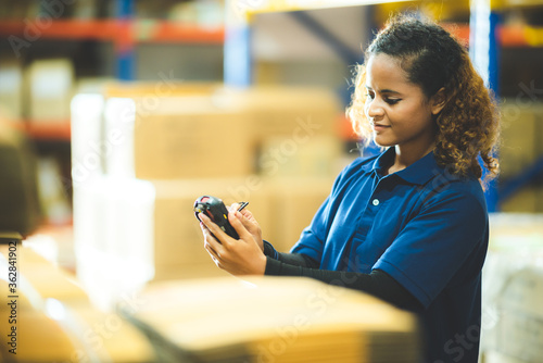 warehouse worker using bar ...