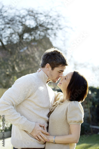 Couple kissing in the park © ImageHit