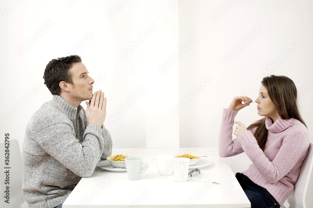 Couple having breakfast cereal