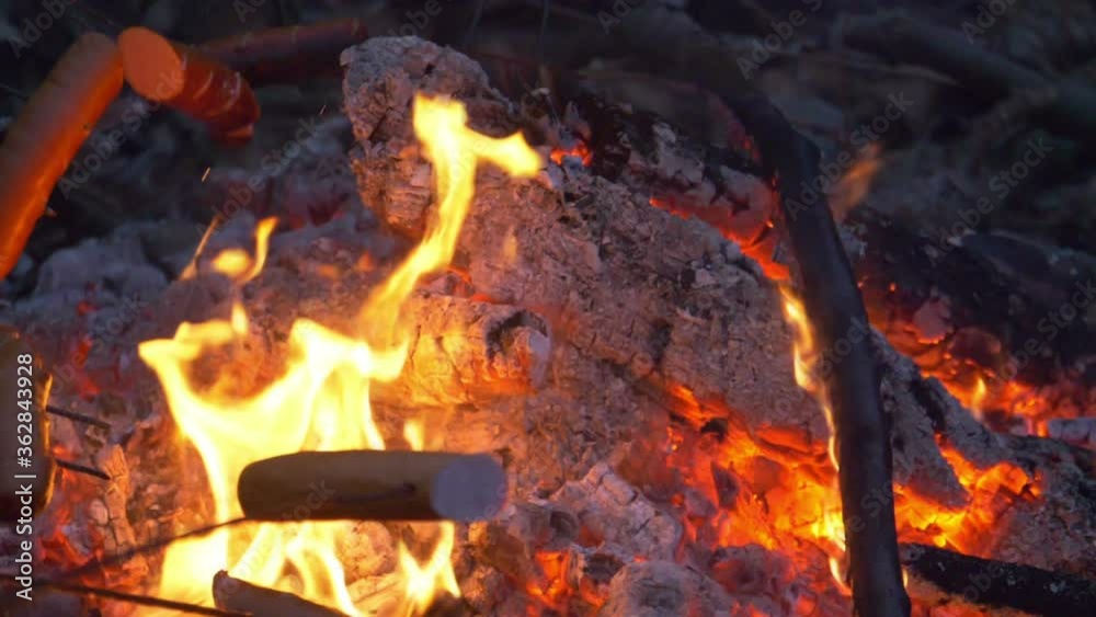 Roasting sausages on the bonfire in slow motion 180fps Roasting sausages on the bonfire in slow motion 180fps