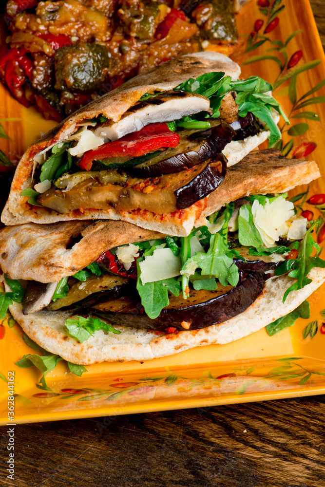 Sandwiches. Roasted and grilled Vegetables served on toasted focaccia bread. Deli style sandwiches with roasted red peppers, squash, basil and pesto spread. Classic American lunch favorite.