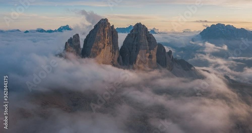 4K, 10BIT, YUV422 timelapse of Tre Cime National park or Three Peaks in sunset with cloud sea and colorful light, Dolomites,the Alps, Italy