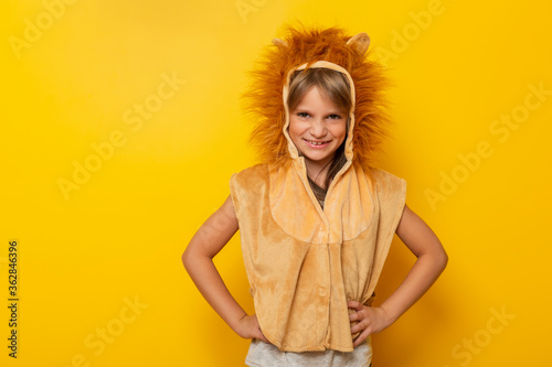 Little girl wearing lion costume
