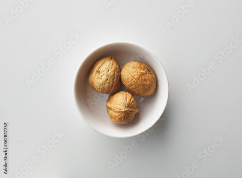 top view shot of walnut on white background.