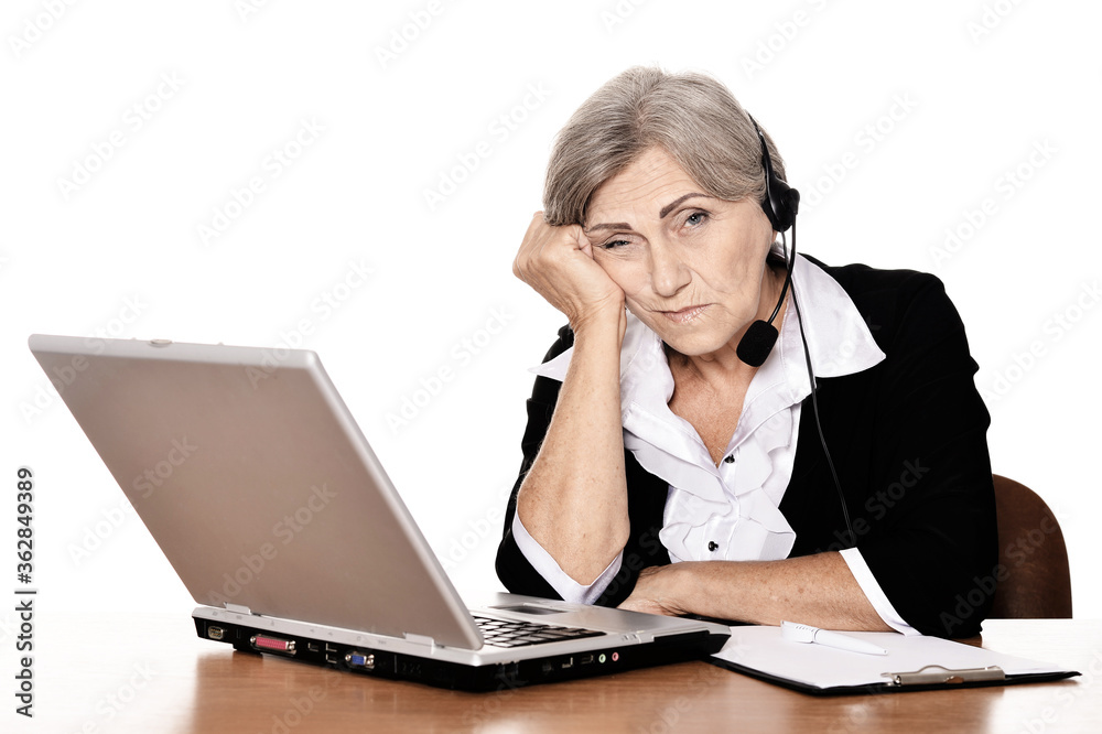 Portrait of elderly woman working in office Portrait of elderly woman working in office